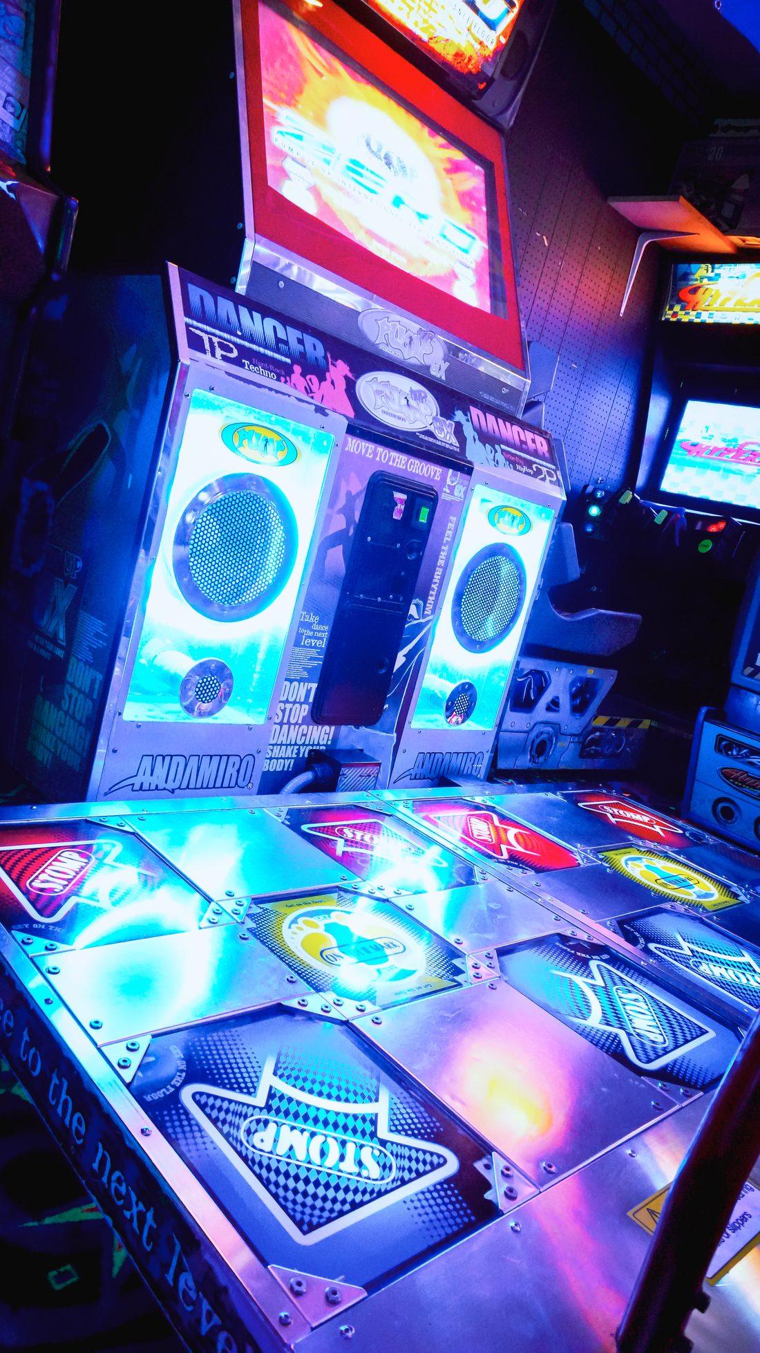 Dance machine glowing blue in the arcade