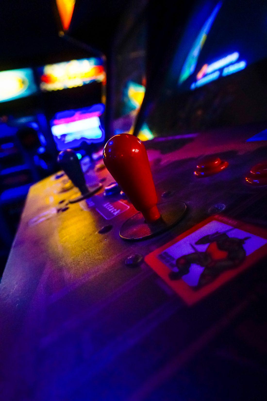 Close-up of a red arcade joystick