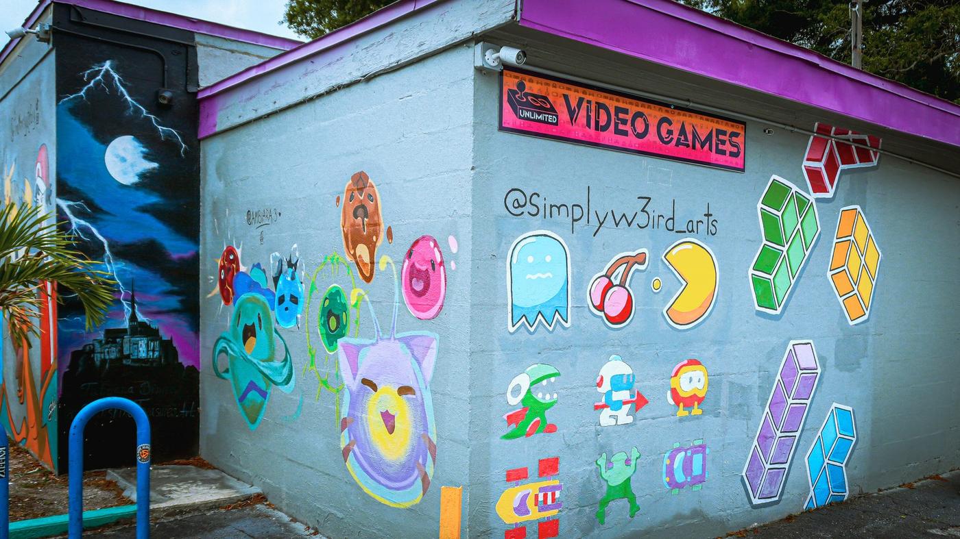 The outside wall painted with a Pac-Man style game mural